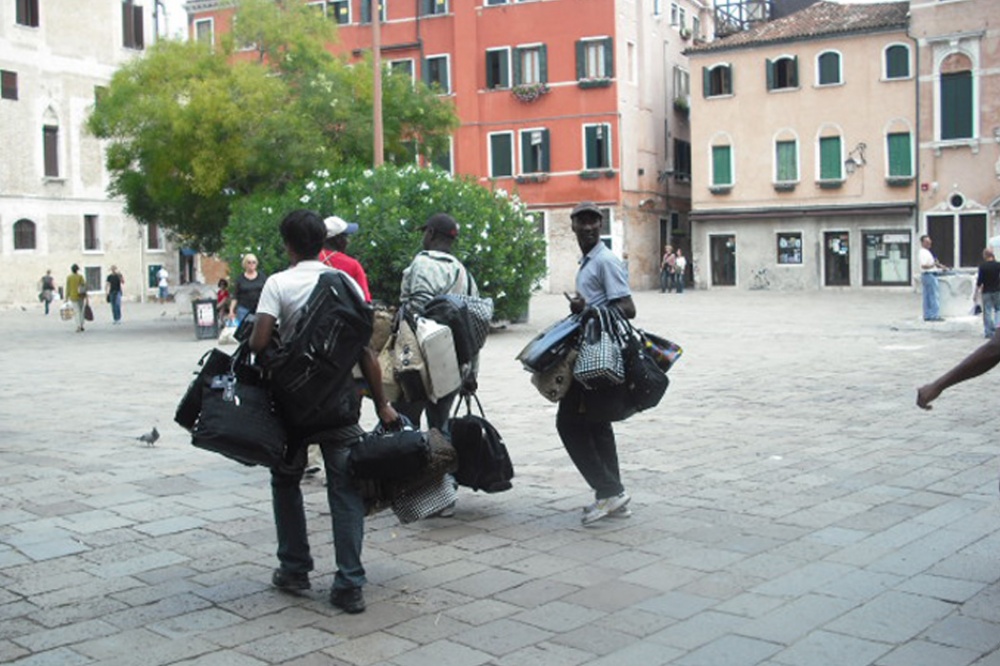 Street vendors really want you to pick up these bags quickly because there is never that much time before not being what they seem present a little legal difficulty...